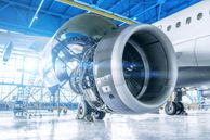 Industrial theme view. Repair and maintenance of aircraft engine on the wing of the aircraft.